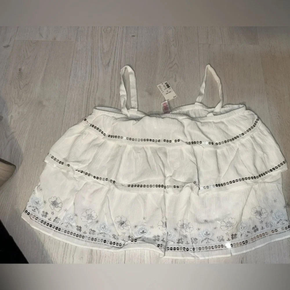 New justice ruffle top